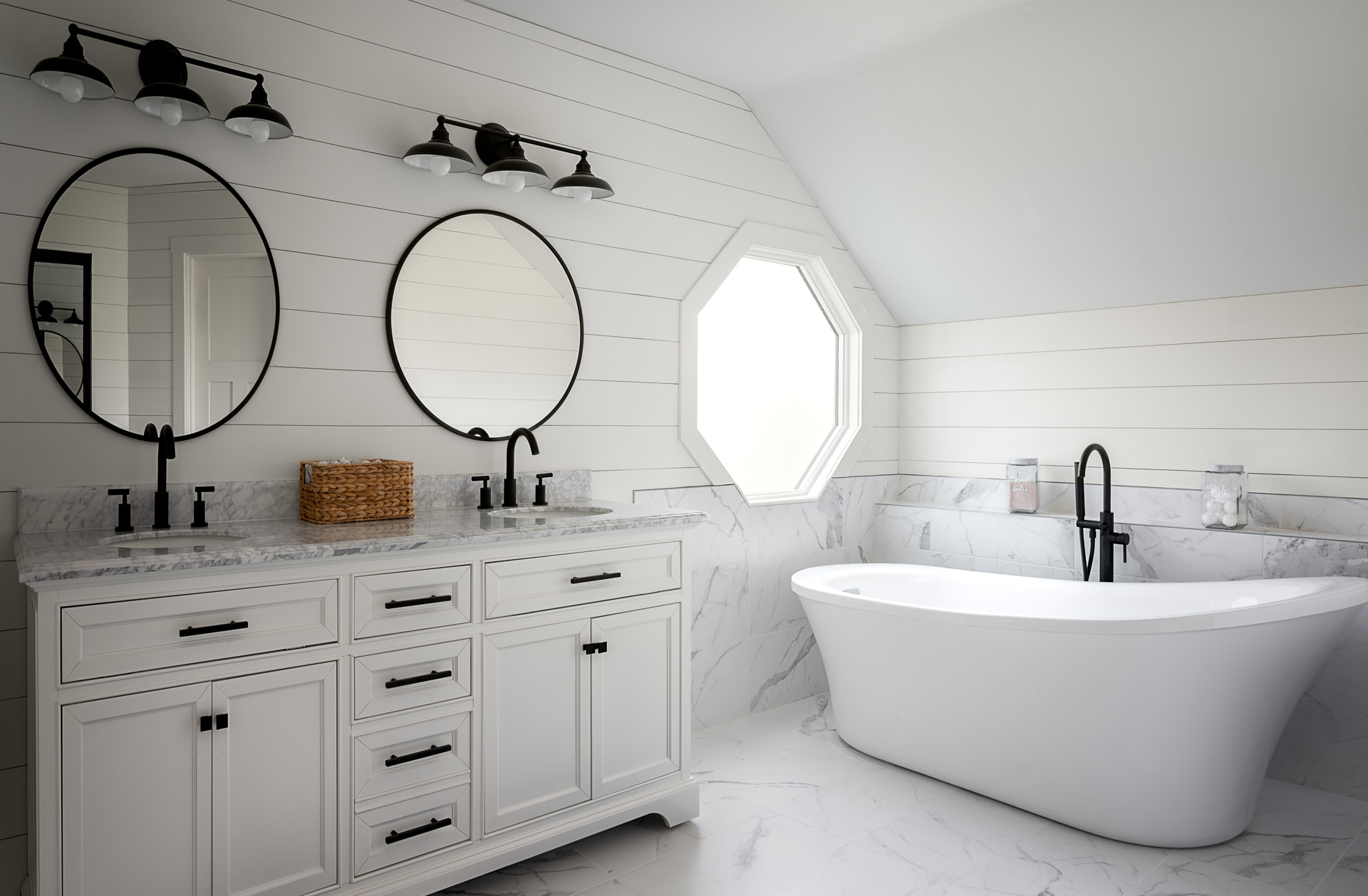 Bright and modern top floor bathroom with large soaker tub.