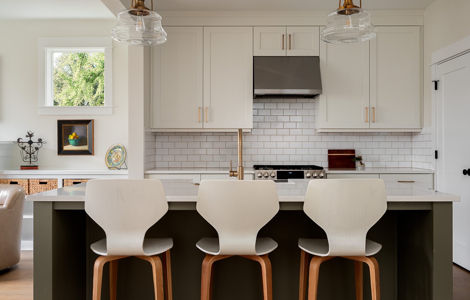 White, clean and modern kitchen with tile backsplash.